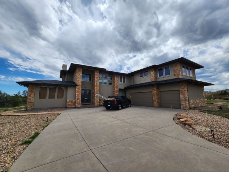 Roofing and exterior company repaired roof, gutters and paint on this home in castle rock, colorado