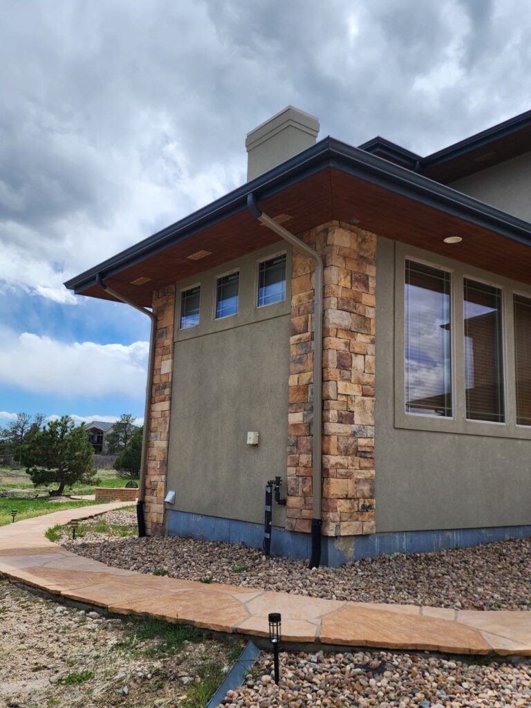 Roofing and exterior company repaired roof, gutters and paint on this home in castle rock, colorado