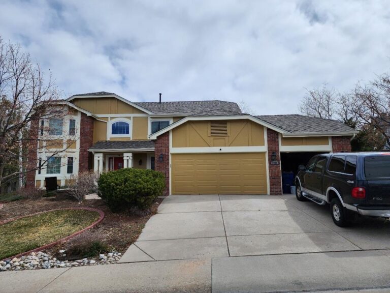 Roofing and exterior company repaired roof, gutters and paint on this home in castle rock, colorado