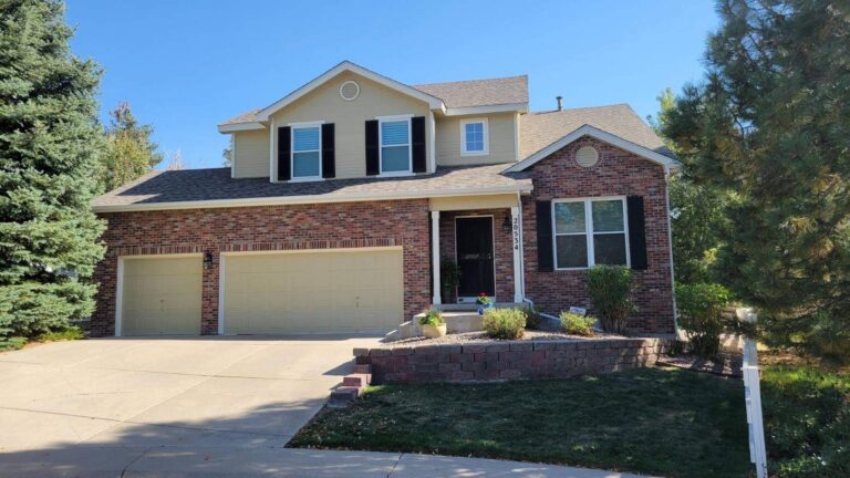 Roofing and exterior company repaired roof, gutters and paint on this home in aurora, colorado