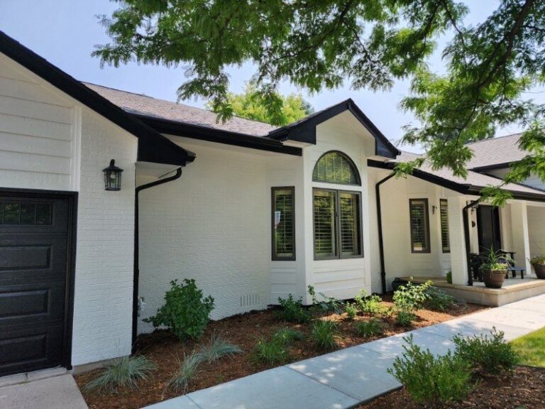 Roofing and exterior company repaired roof, gutters and paint on this home in littleton, colorado